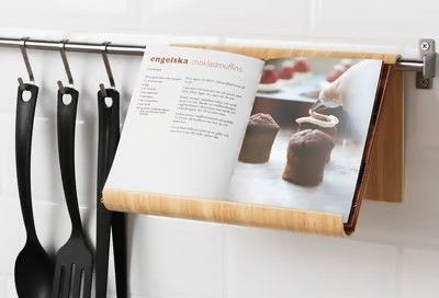 A book stand with open cookbook inside.