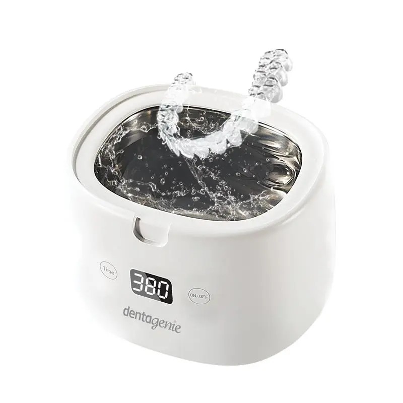 A small white, Dentagenie cleaning device for dental devices.