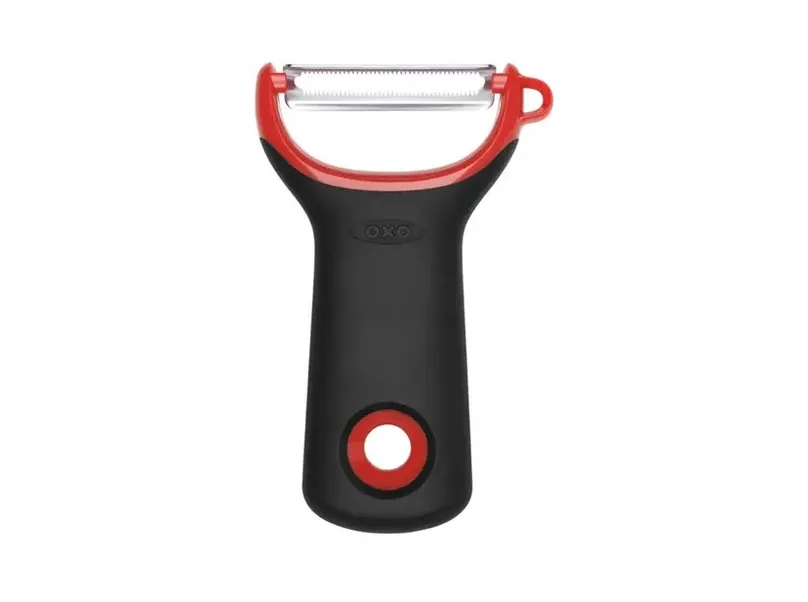 A wide-grip vegetable peeler.