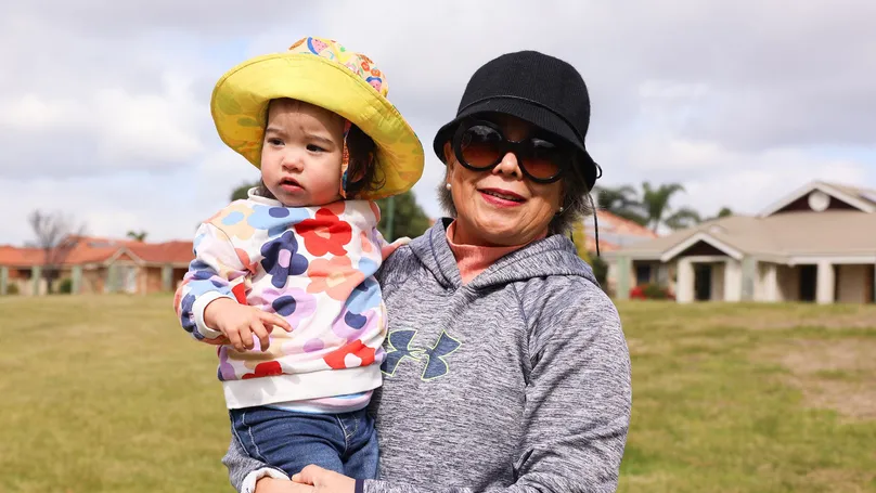 Grandmum and grandaughter outside