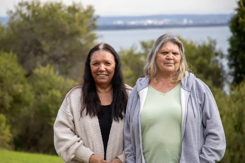 Two ladies chat and enjoy the wellbeing benefits of connecting on Country