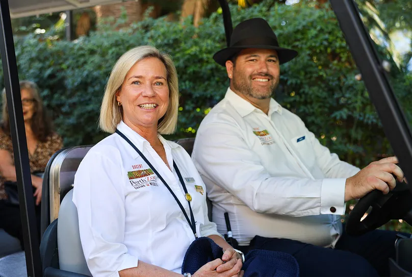 Perth Zoo Docents riding in their cart.