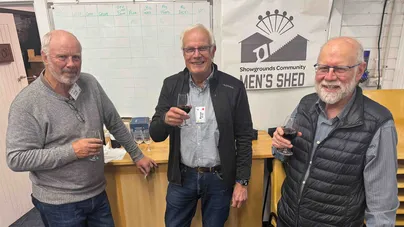 Men's Shed members with wine.