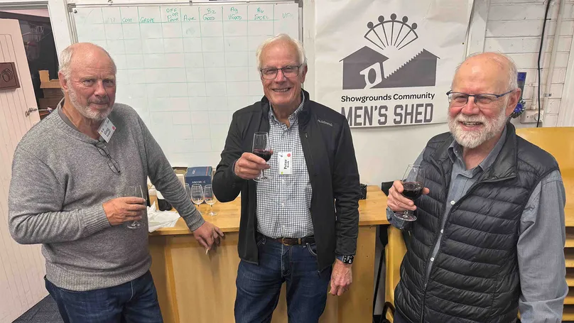 Men's Shed members with wine.