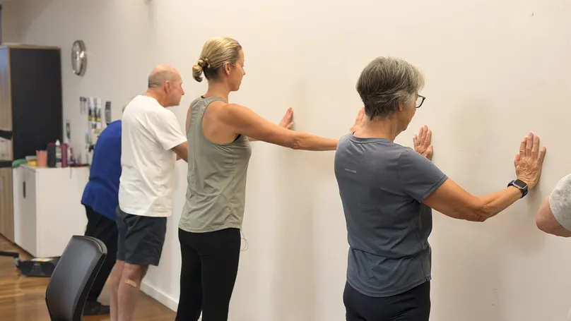 Kamilla Haufort demonstrating the extended position in a wall push up.