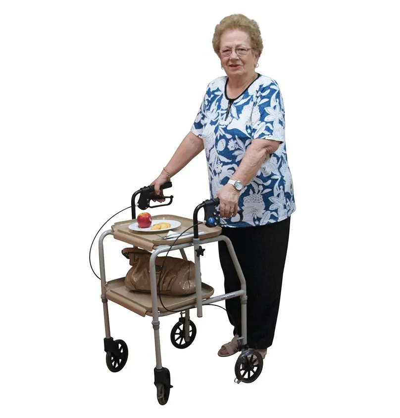 An older woman using a walker with tray.