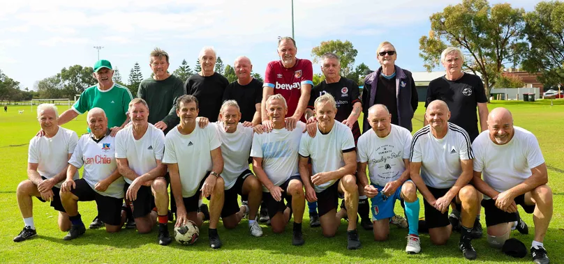 A group picture of a walking football team.