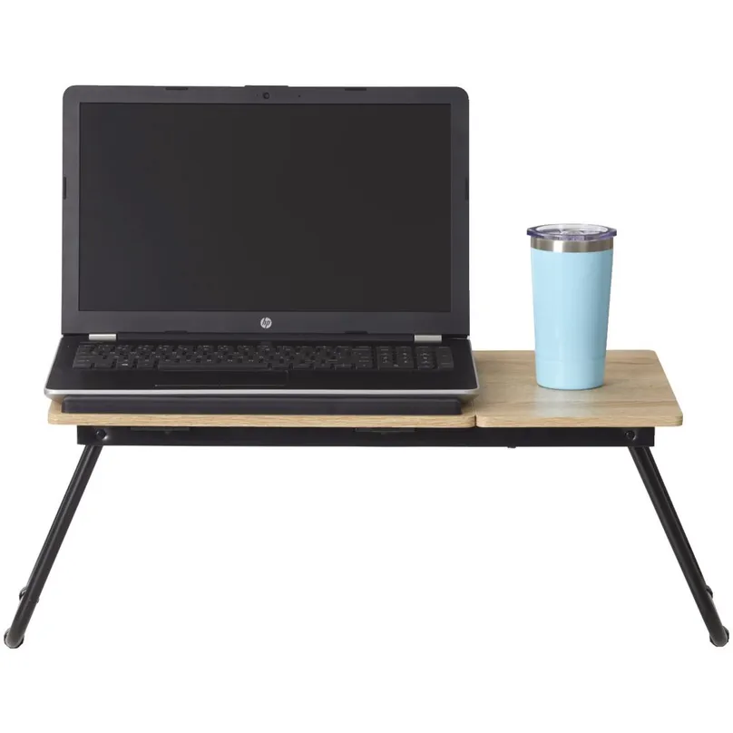 A laptop and thermos on a portable laptop table.