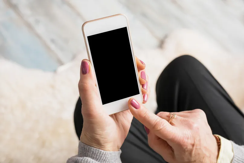 A person using a phone.