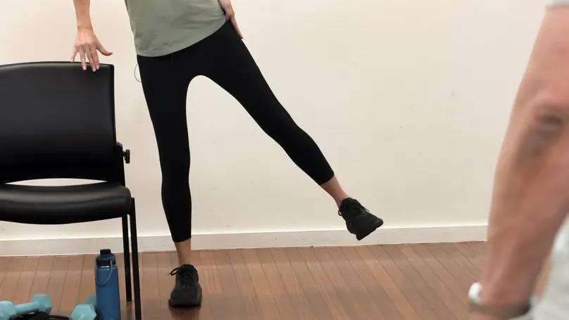 Kamilla Haufort demonstrating the side leg lift exercise.