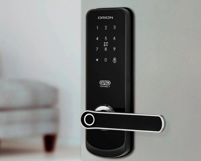 An open door with a smart lock on it.